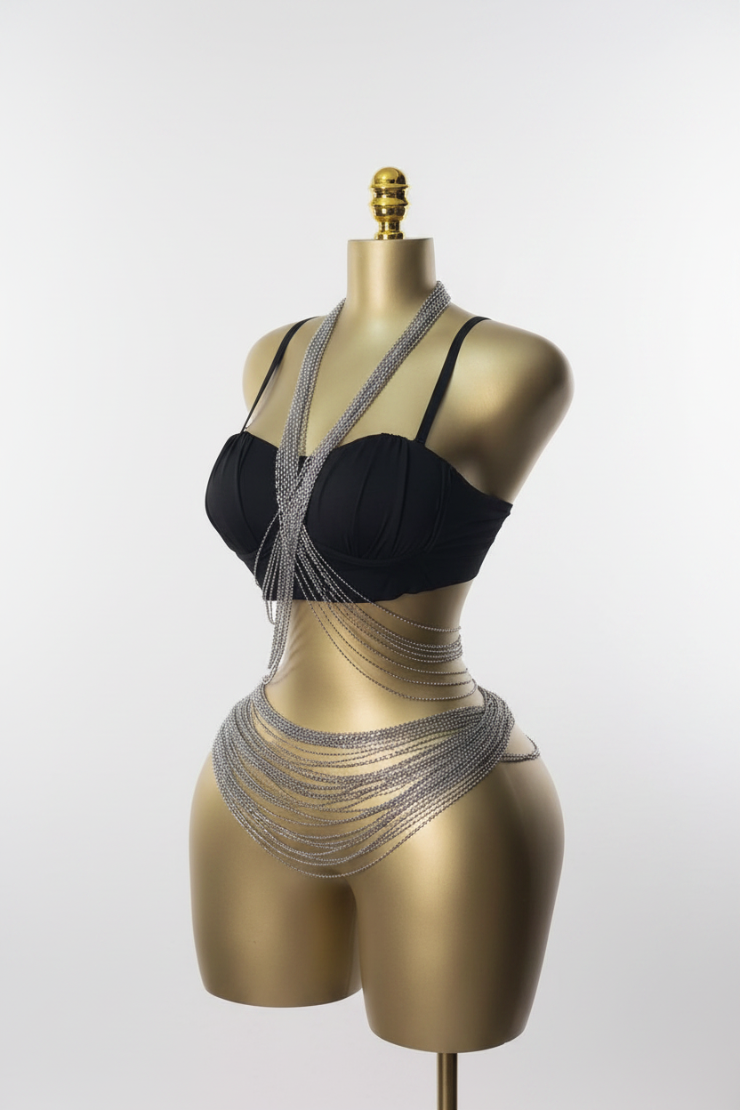 Layered silver body chains on gold mannequin white background